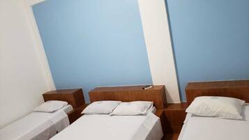 Standard Quadruple Room | Desk, blackout drapes, soundproofing, iron/ironing board