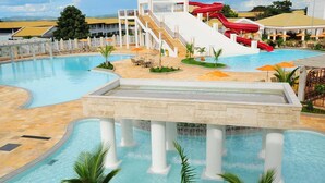 A water park with multiple pools, slides, and lounge areas. - Lacqua Di Roma I Via Caldas (Caldas Novas)