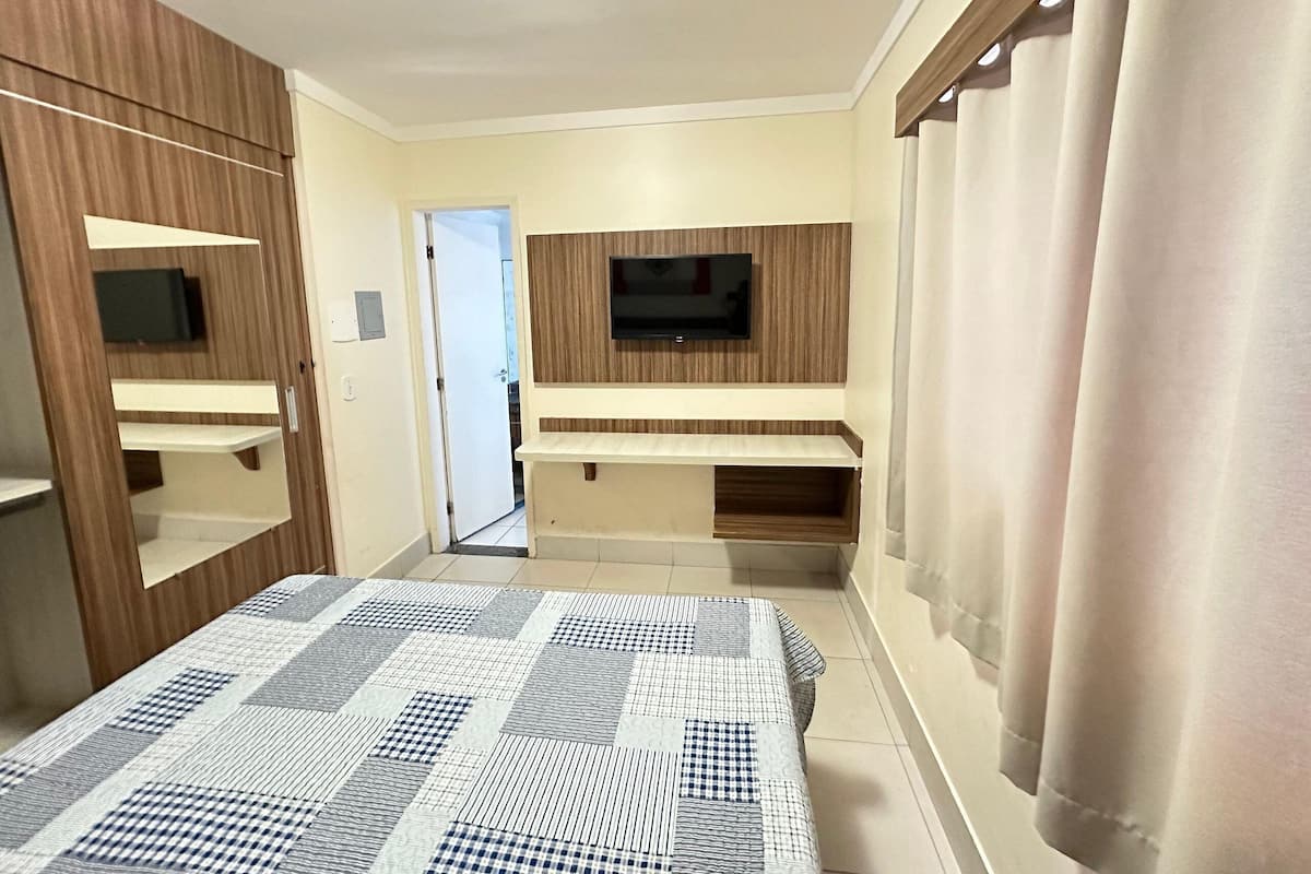 Appartamento | Minibar, tende oscuranti, Wi-Fi gratuito