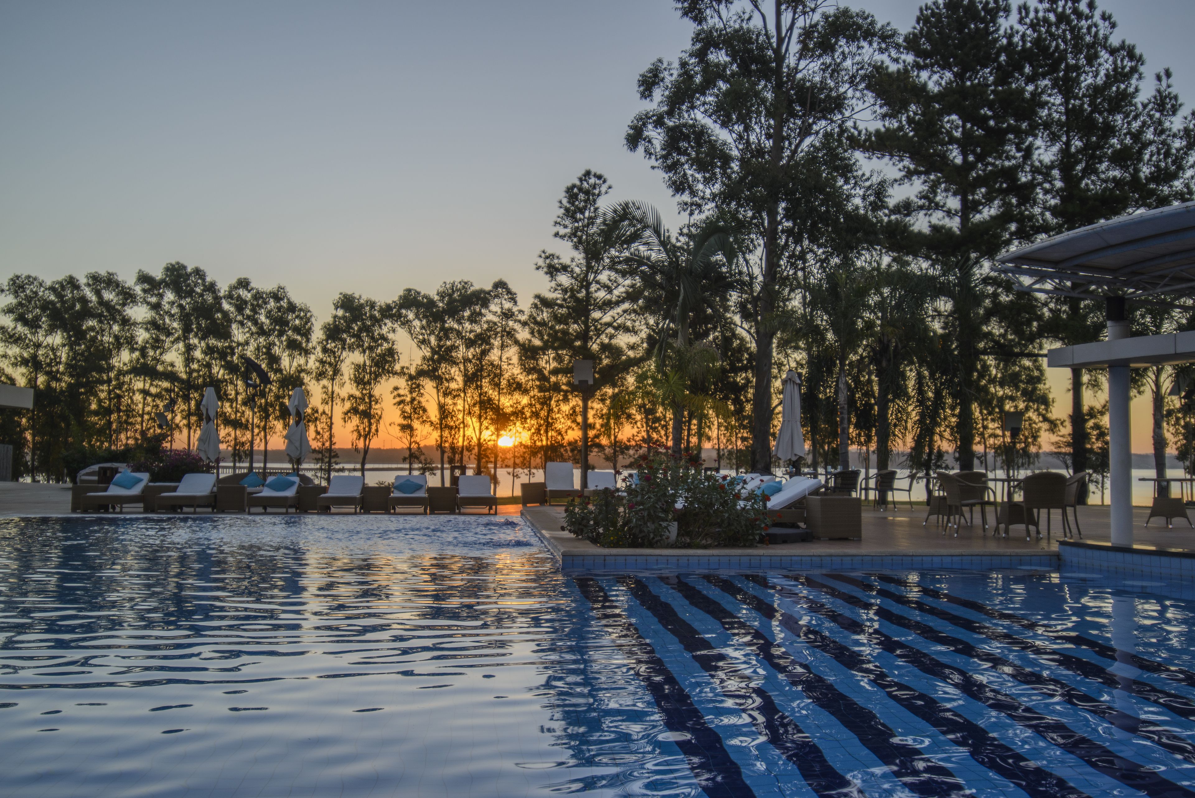 outdoor pool, open 8:00 am to 9:00 pm, pool umbrellas, pool loungers