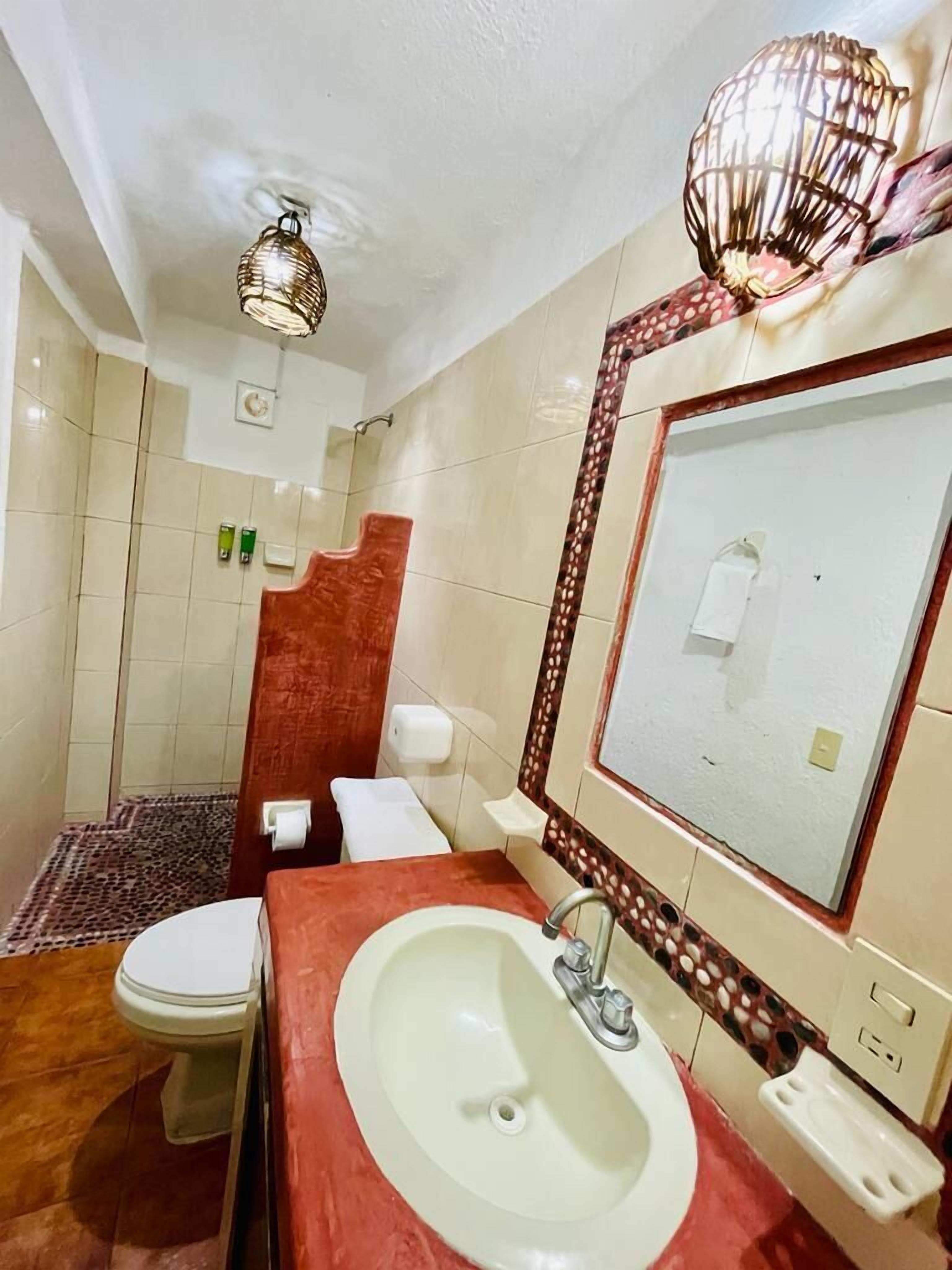 basic room | bathroom | shower, hair dryer, towels, soap