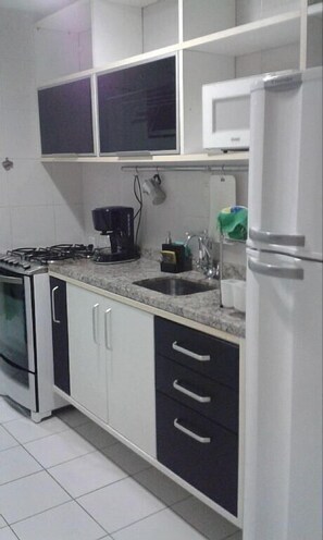 Apartment, 2 Bedrooms | Private kitchen | Fridge, microwave, stovetop, coffee/tea maker