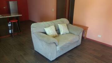 Family Apartment, 2 Bedrooms | Living room | 32-inch flat-screen TV with cable channels, TV