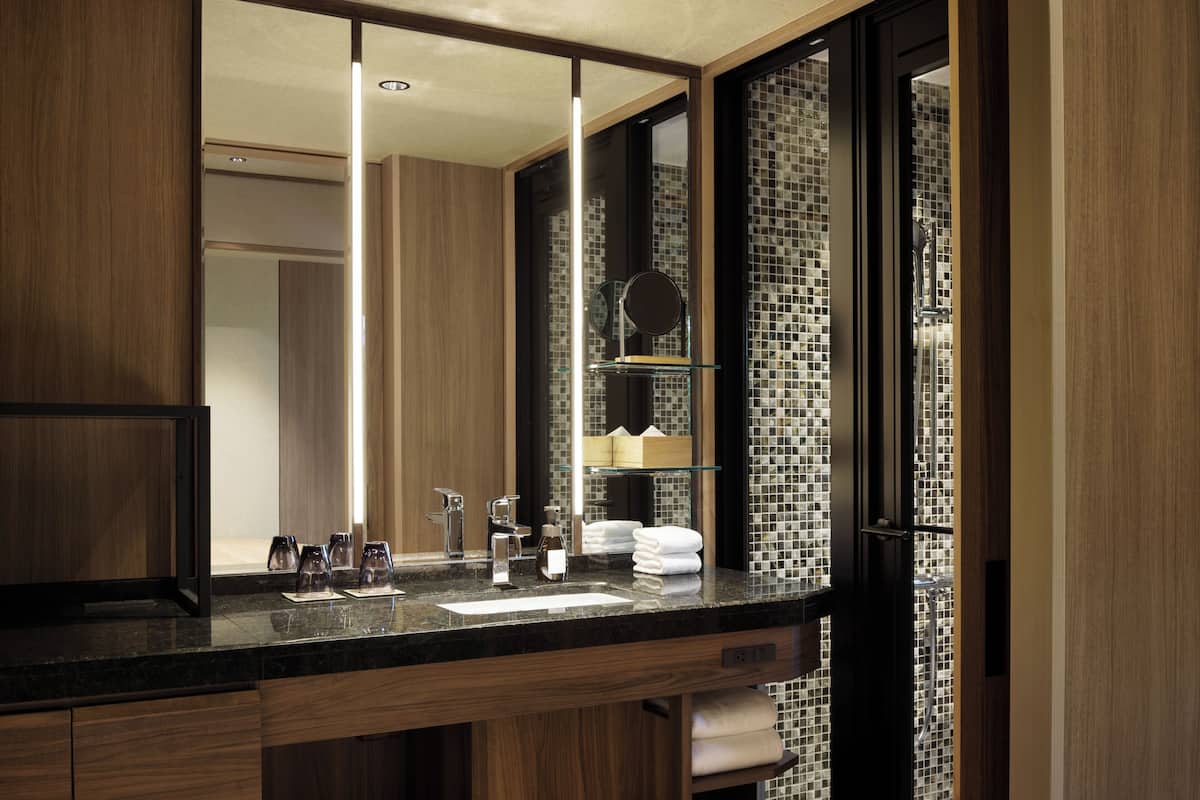 separate bathtub and shower, free toiletries, hair dryer, slippers