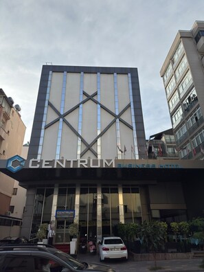 A building with a large sign reading 'CENTRUM BUSINESS HOTEL'. - Centrum Business Hotel (Adana)