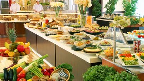 A buffet with various food items and a kitchen area in the background. - Jyoseikan (Kochi)