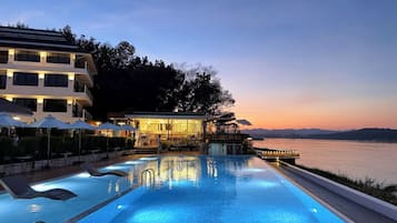 Outdoor pool, open 8:00 AM to 8:00 PM, pool umbrellas, sun loungers