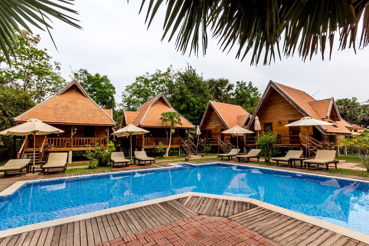 Deluxe Triple Room, Pool View | Outdoor pool