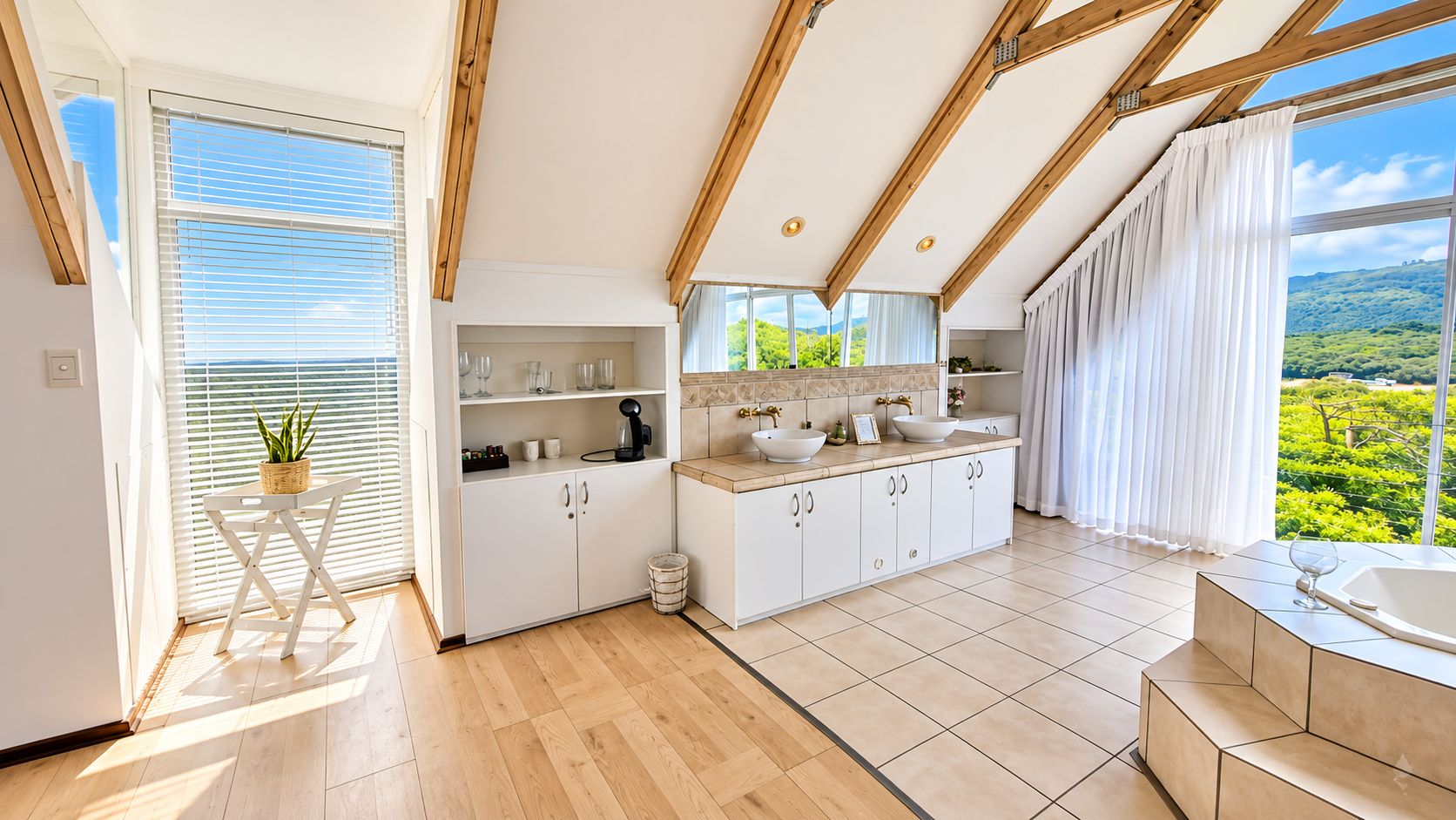 A modern kitchen with a view of a lush landscape, wooden beams, and a large window.