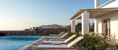 Outdoor pool, open 8 AM to 10 PM, pool umbrellas, sun loungers