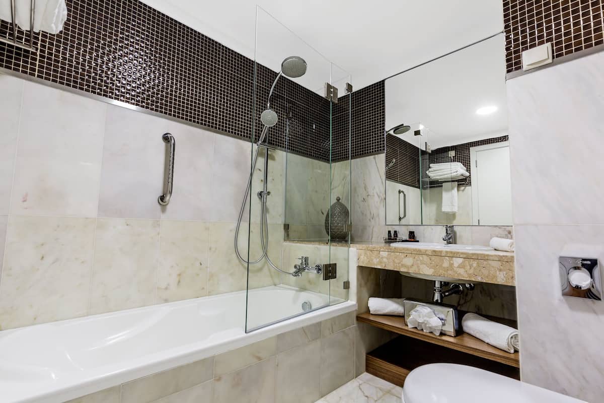 bathtub, free toiletries, hair dryer, bathrobes