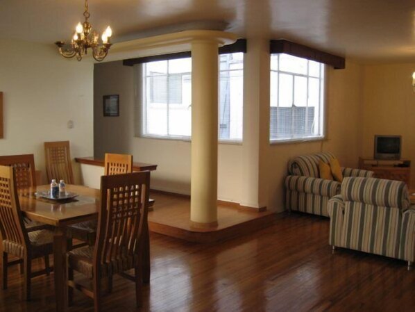 Deluxe Suite, 2 Bedrooms | Living area | Flat-screen TV