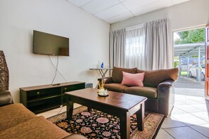 32-inch flat-screen TV with satellite channels, TV