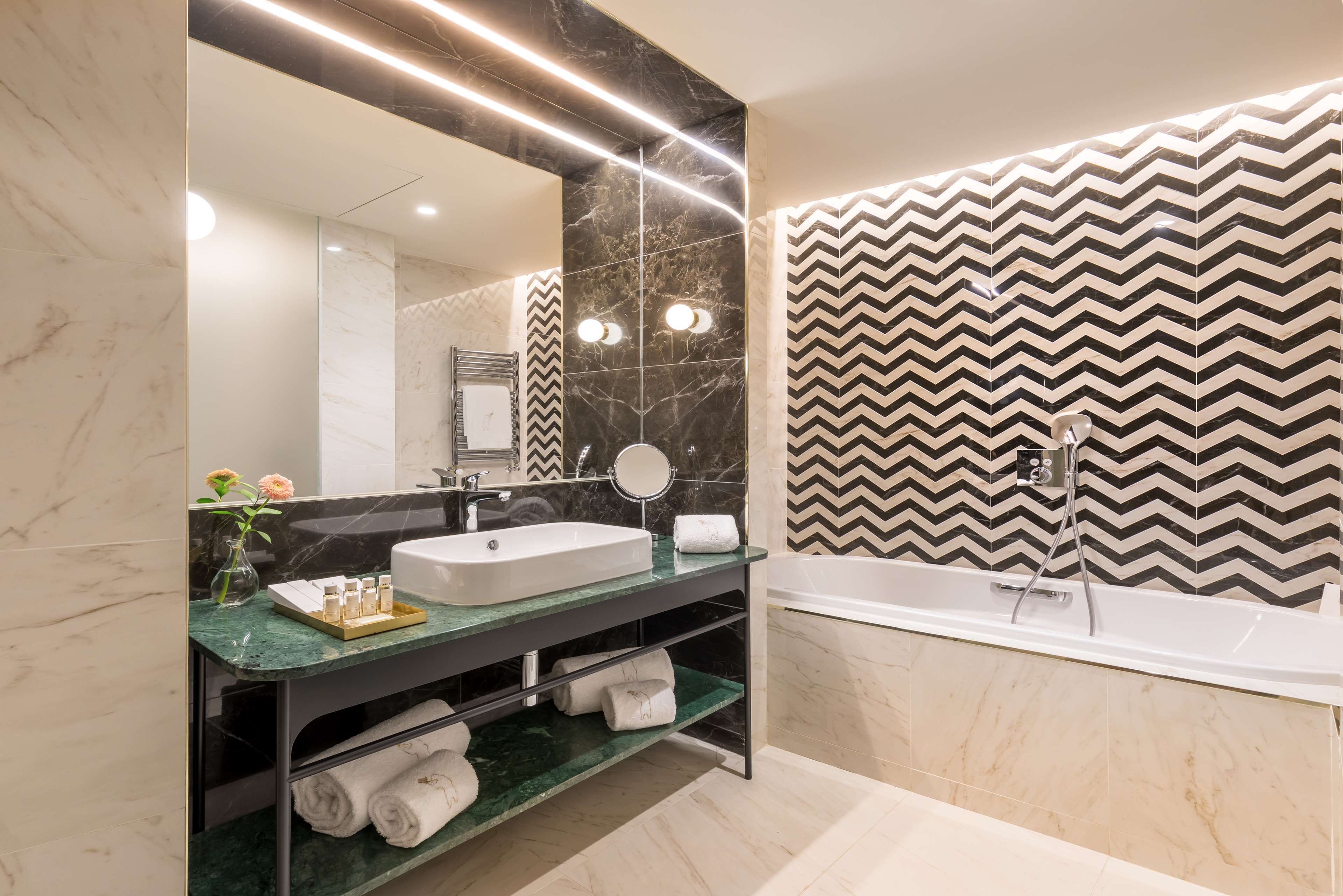 designer toiletries, hair dryer, bathrobes, slippers