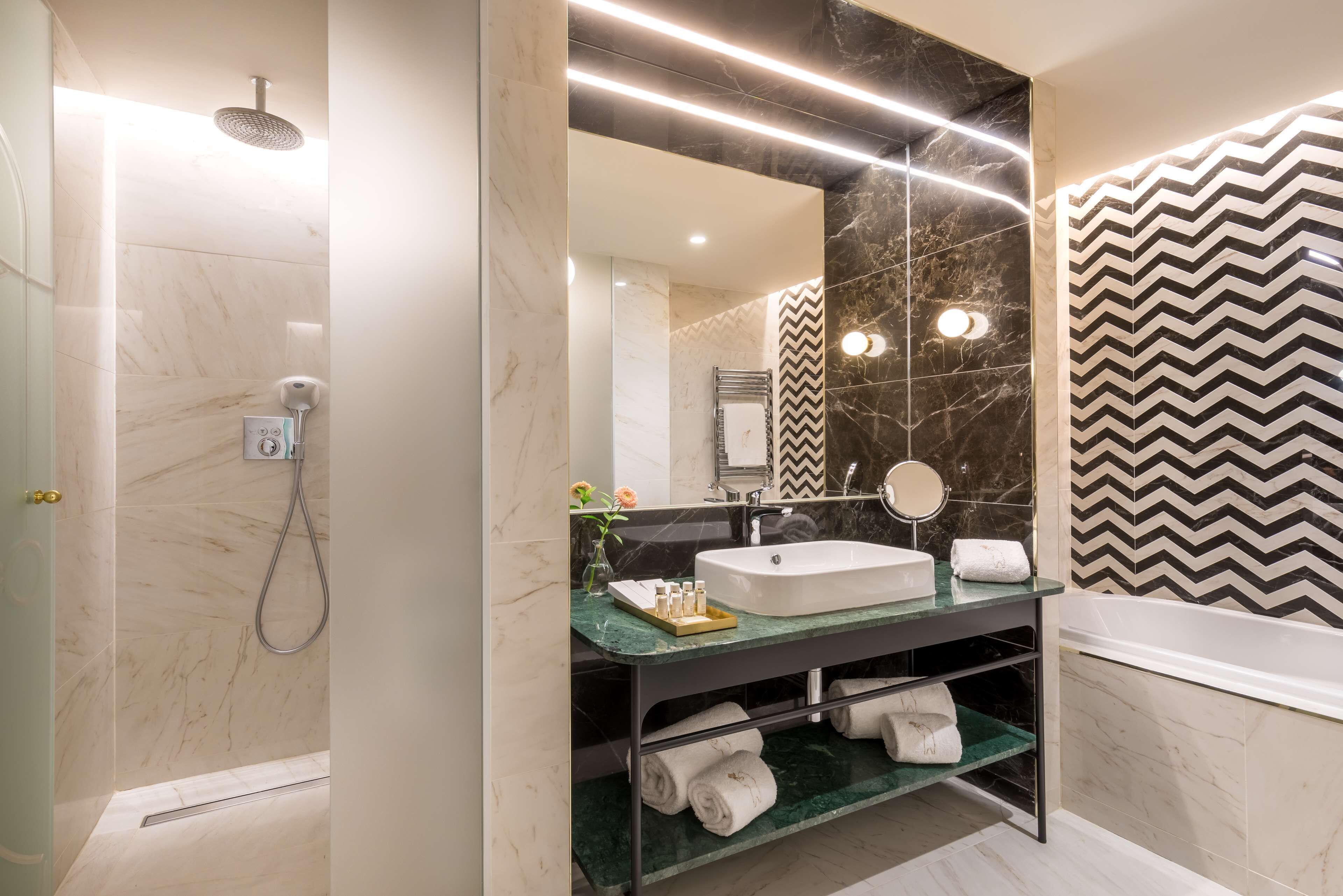 designer toiletries, hair dryer, bathrobes, slippers