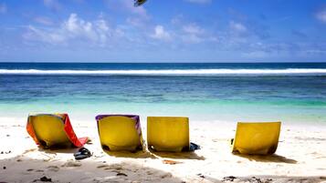 On the beach, white sand, beach towels