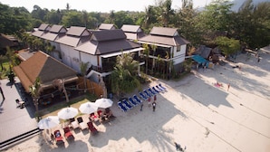 A resort with multiple buildings, a beach area with sun loungers, and a sign that reads "Resort". - Cabana Lipe Beach Resort (Koh Lipe)