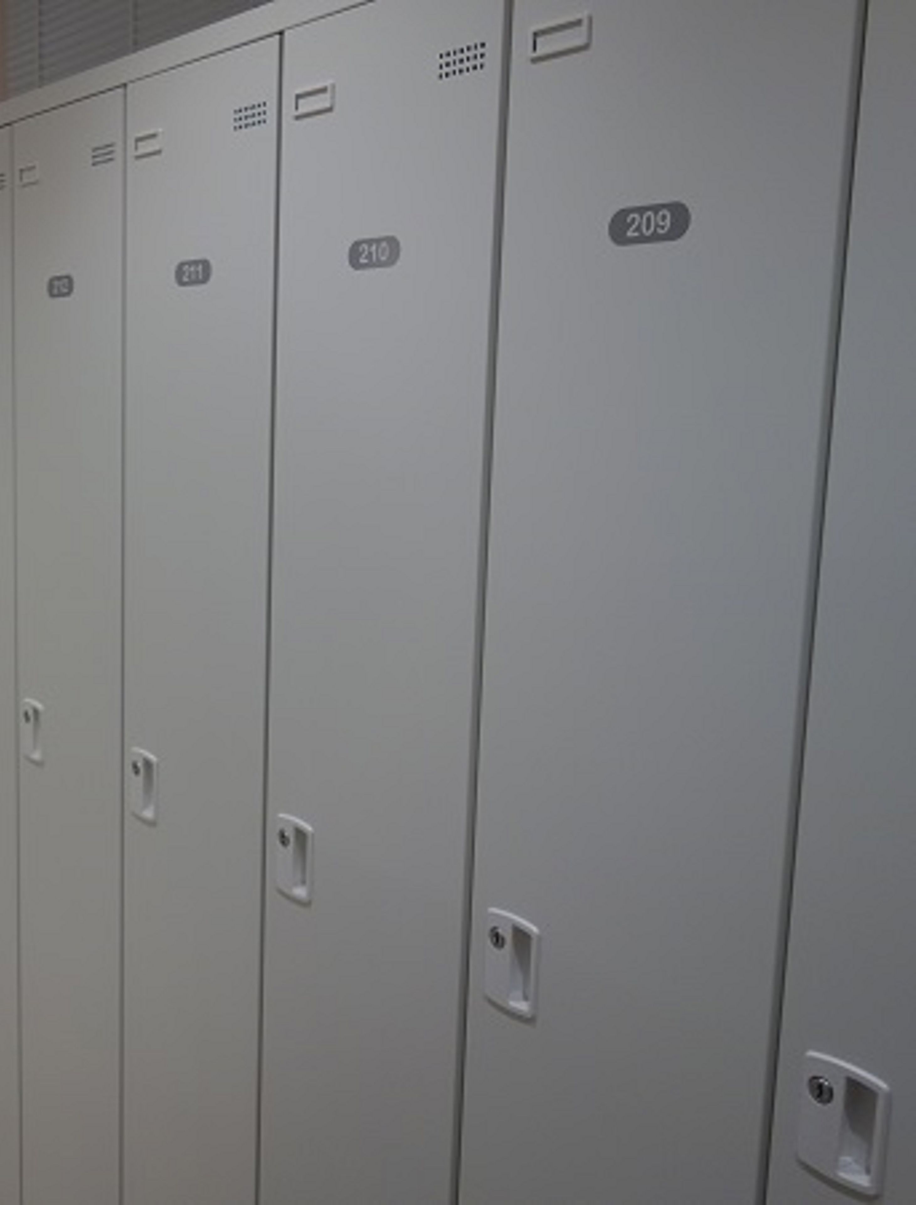 A row of grey lockers with numbers 209, 210, and 211 visible.