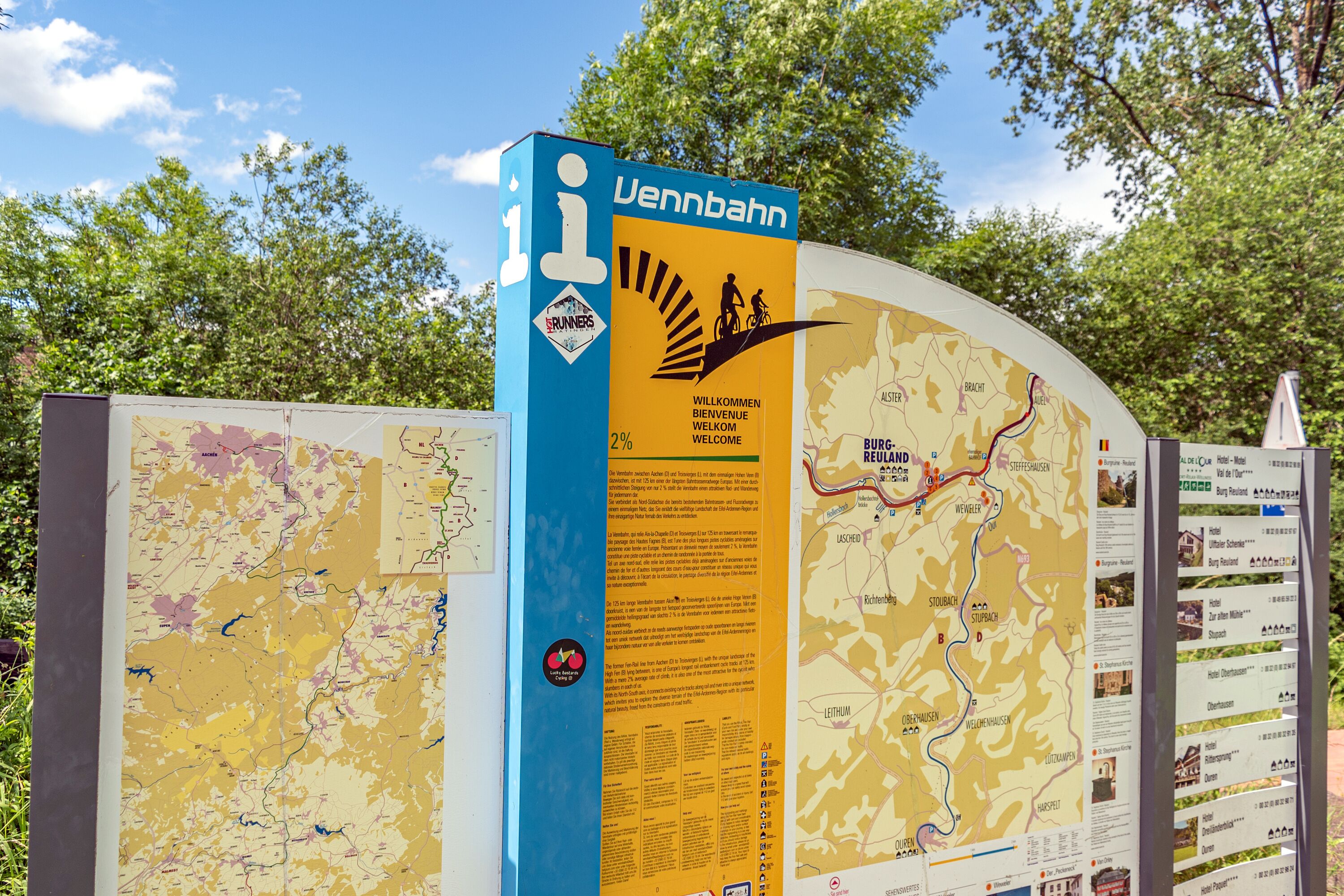 A map with a blue and yellow signboard, including a logo and text.