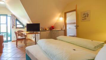 Apartment, 1 Bedroom (2 Adults, room number 1-4) | Minibar, in-room safe, desk, soundproofing