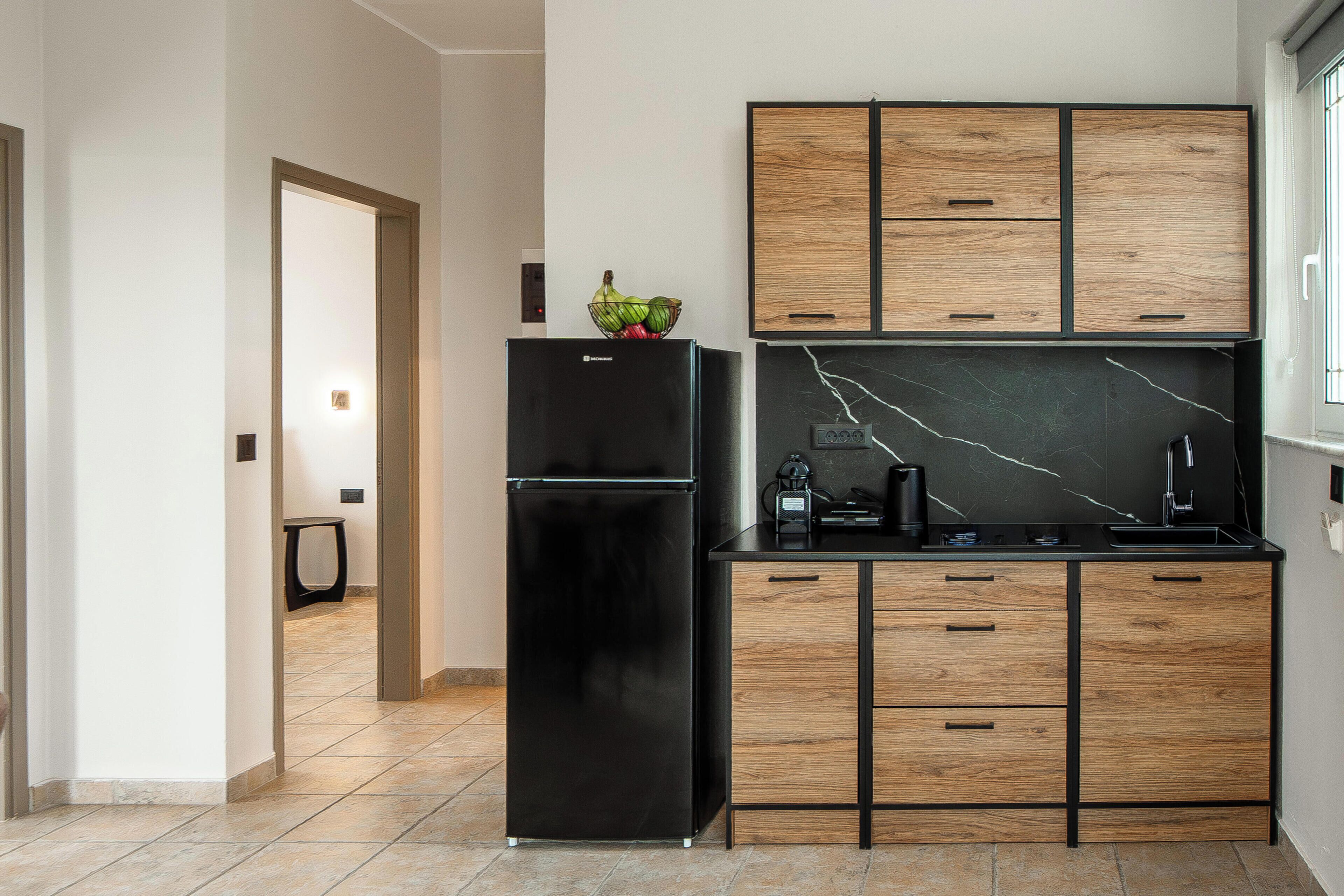 Superior Apartment | Private kitchen | Fridge, electric kettle, coffee grinder, cleaning supplies
