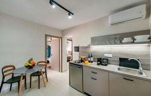 Superior Apartment | Private kitchen | Fridge, stovetop, electric kettle, coffee grinder