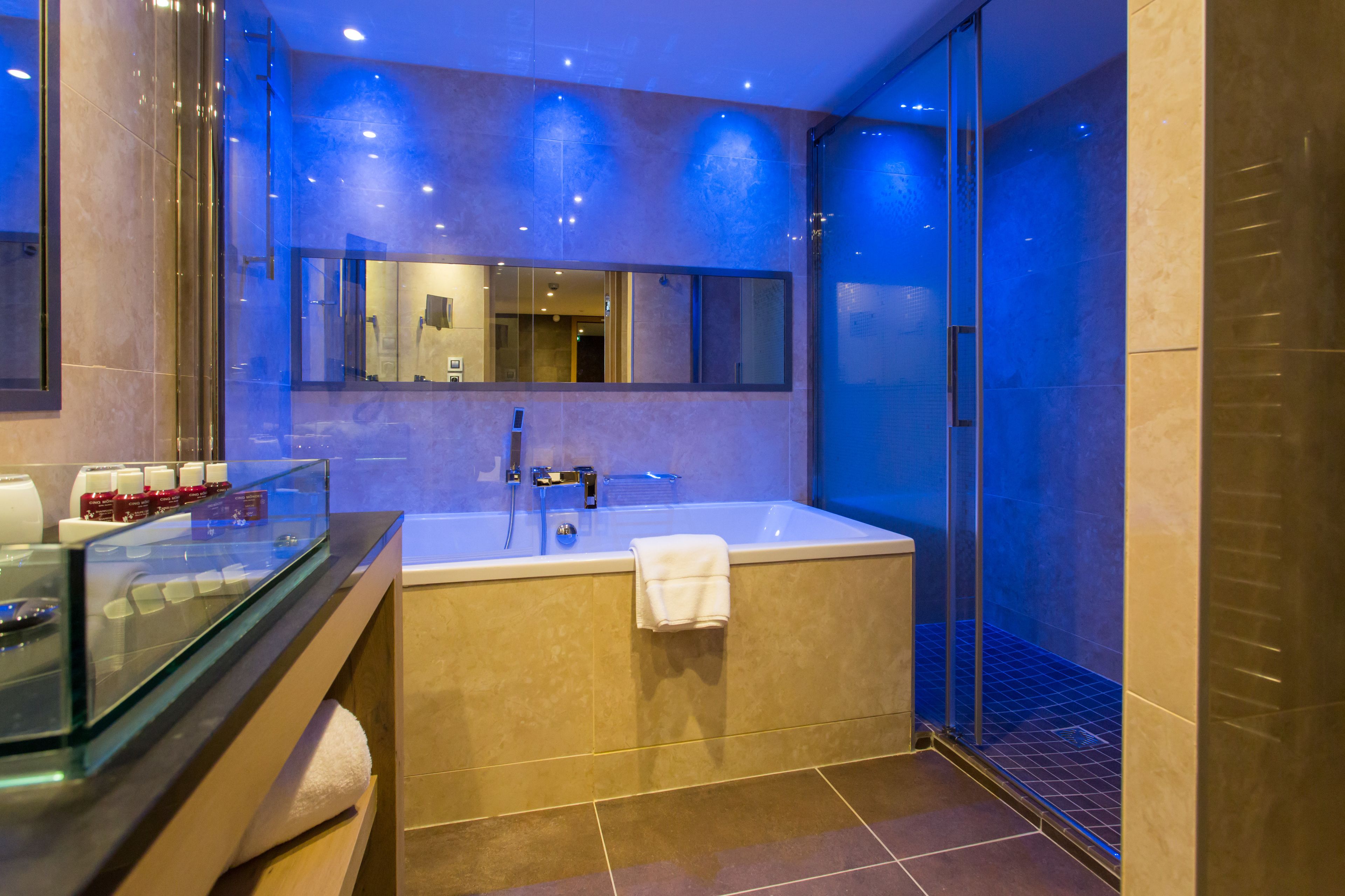 bathtub, designer toiletries, hair dryer, bathrobes