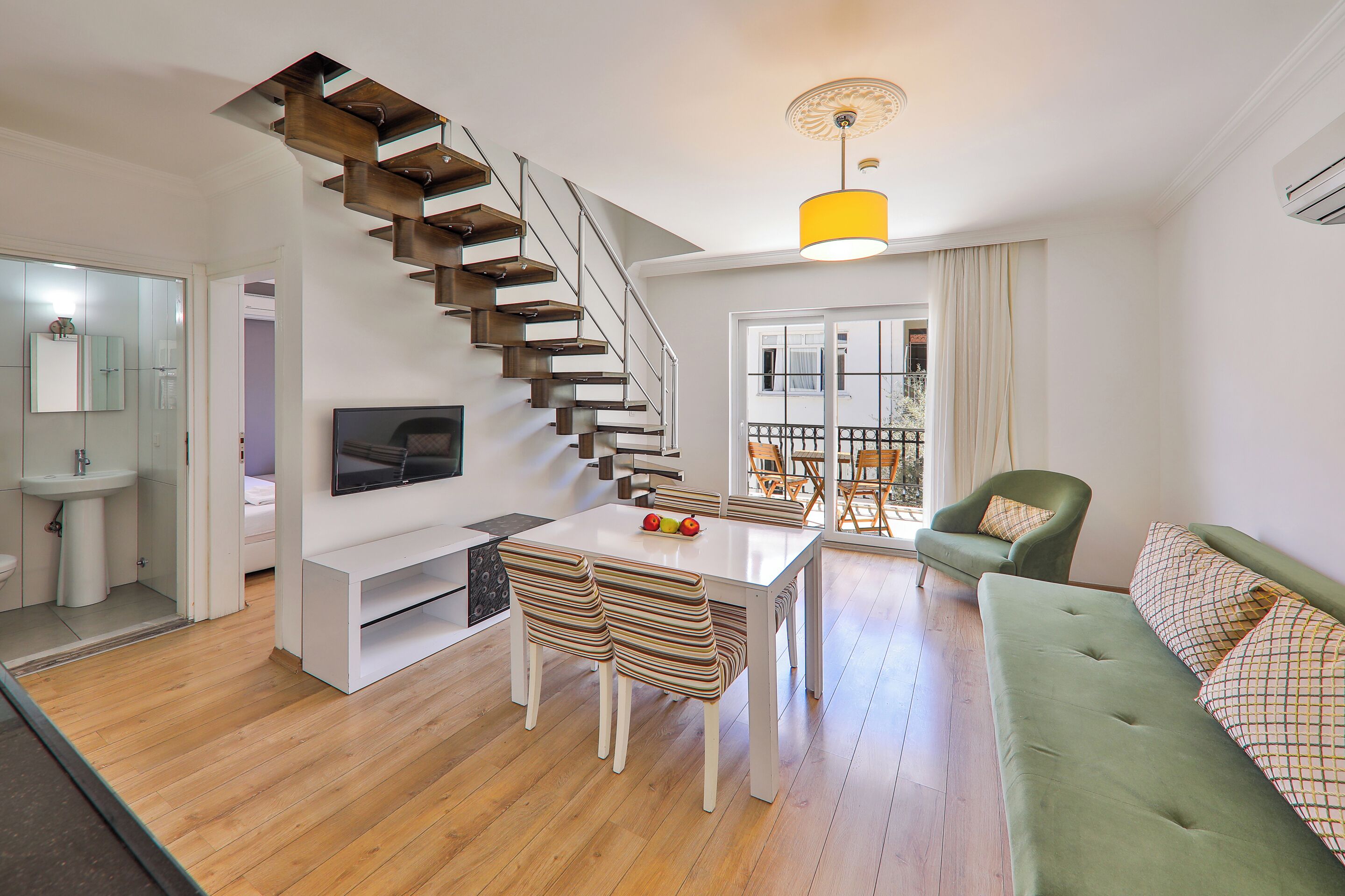 Family Duplex, 2 Bedrooms | Living area | 55-inch Smart TV with satellite channels