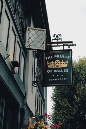 A sign for 'The Prince of Wales Townhouse' with a crown emblem. - Prince of Wales - Townhouse (London)