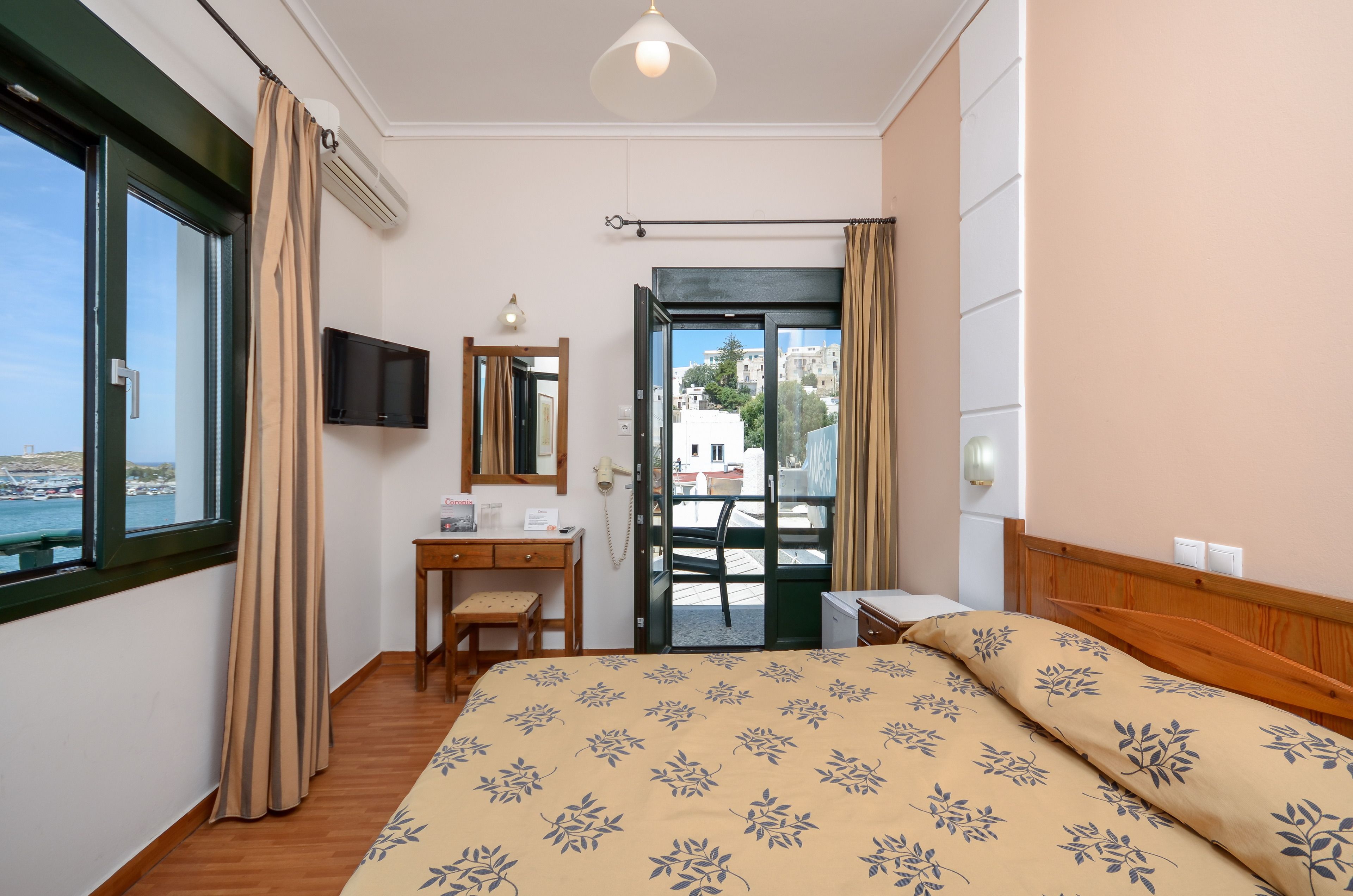 standard room (port view) | 1 bedroom, down duvets, desk, iron/ironing board