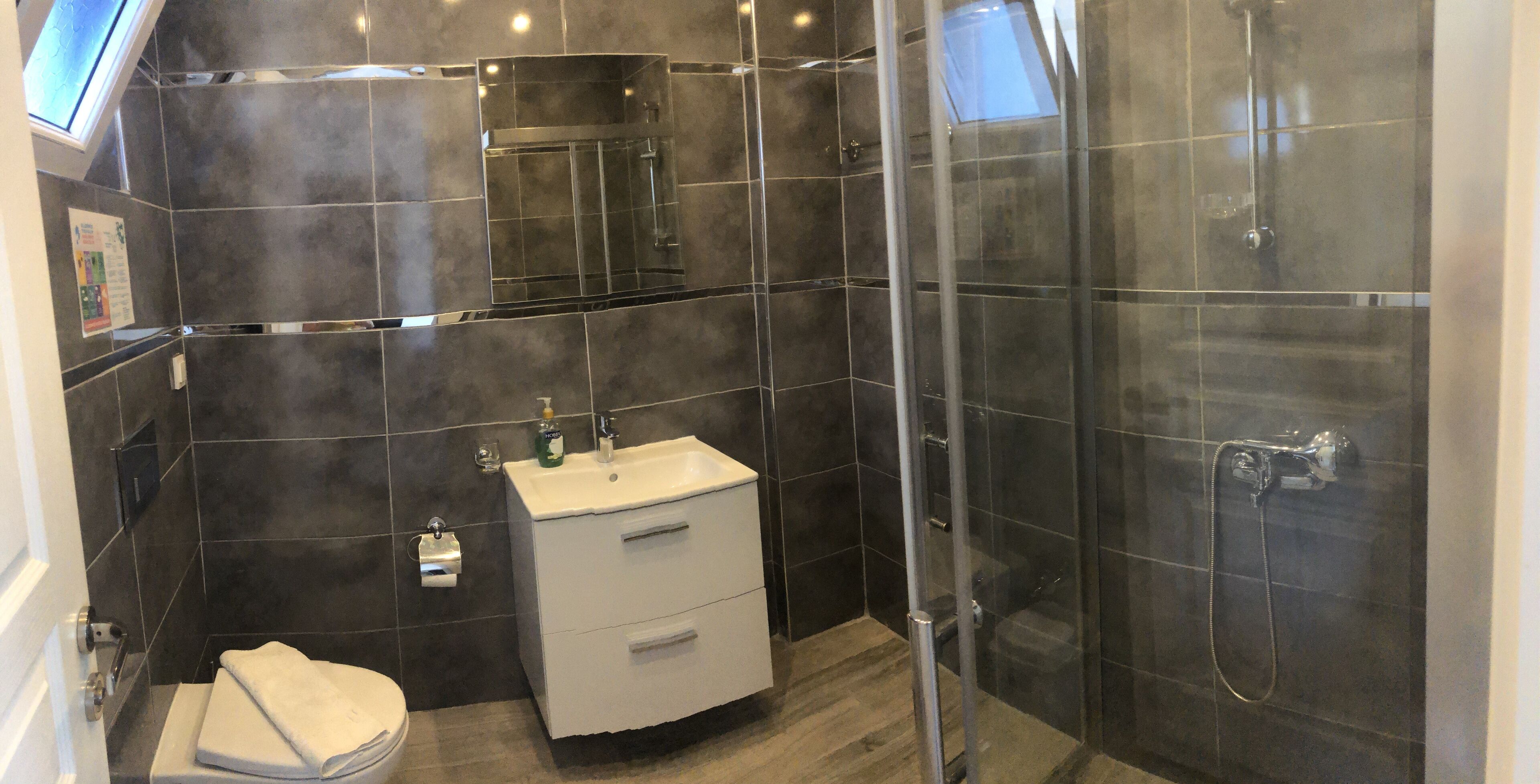 basic quadruple room | bathroom | shower, free toiletries, towels