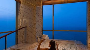 Separate bathtub and shower, rainfall showerhead, designer toiletries