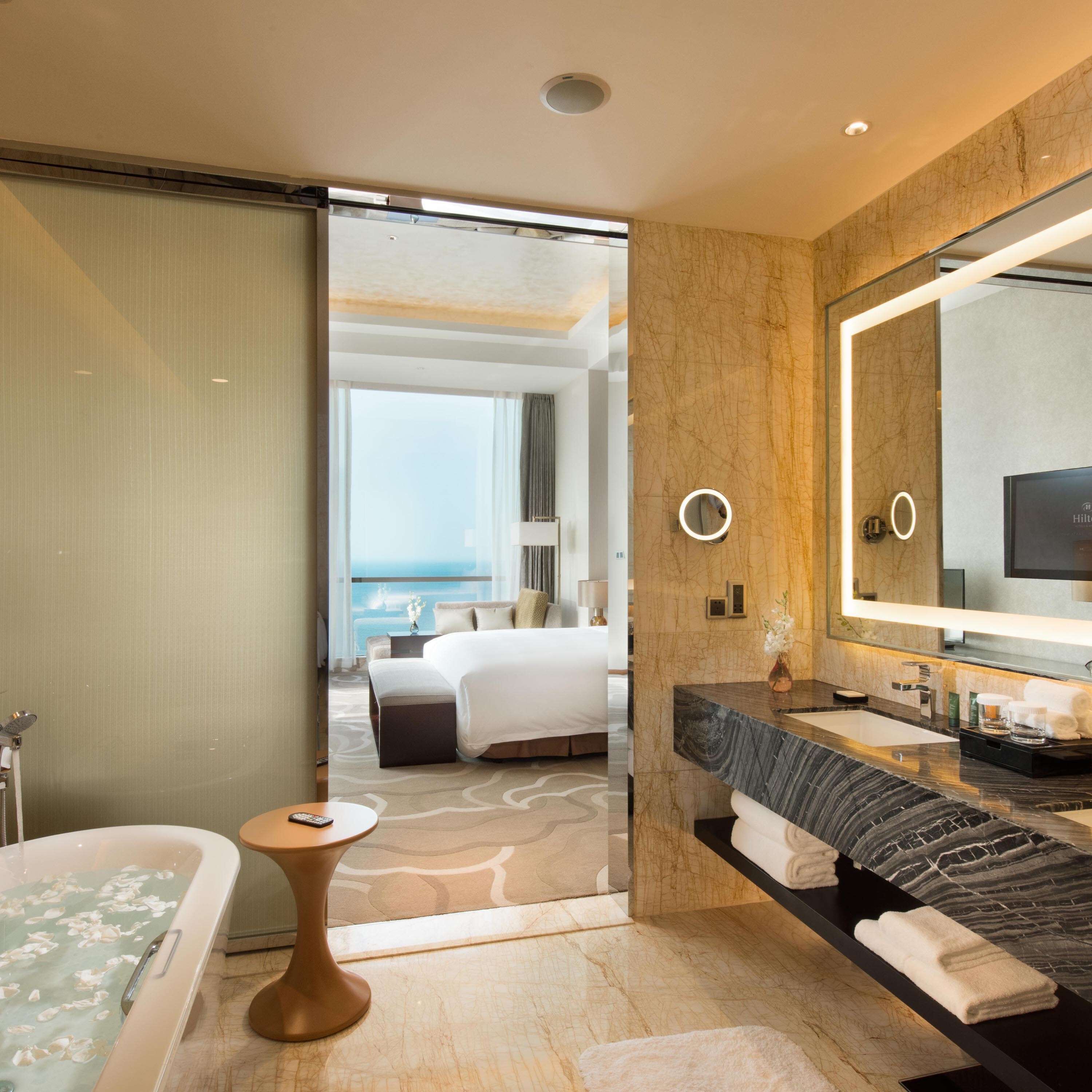 suite, 1 king bed, sea view (with intelligent toilet) | bathroom | separate bathtub and shower, rainfall showerhead, designer toiletries