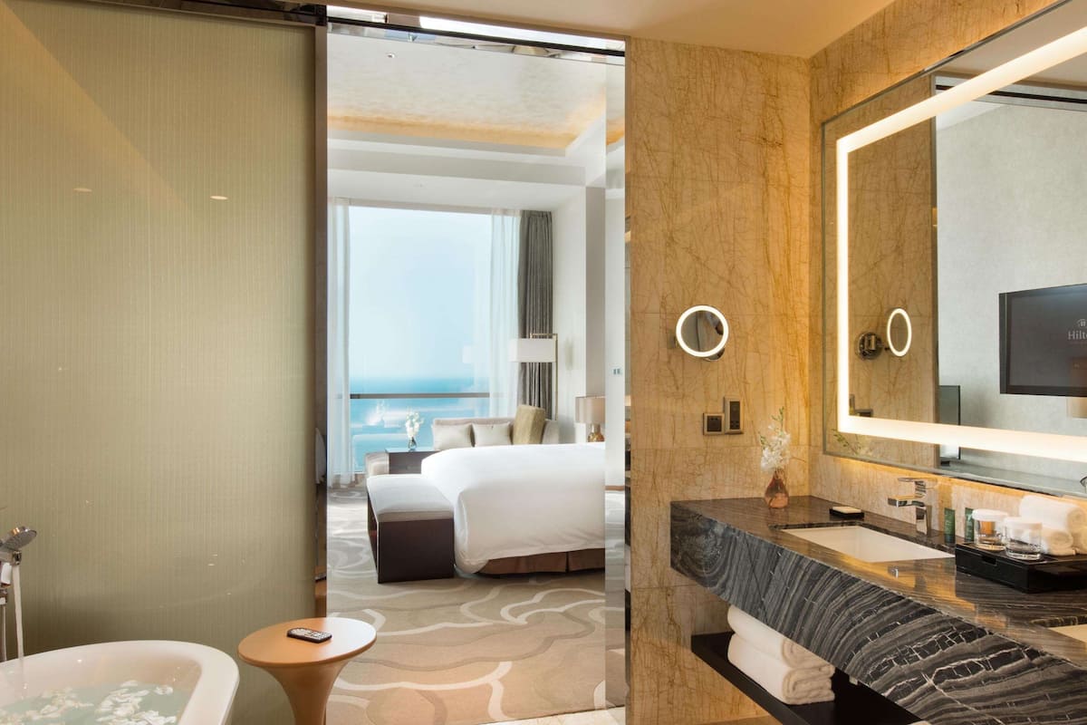 suite, 1 king bed, sea view (with intelligent toilet) | bathroom | separate bathtub and shower, rainfall showerhead, designer toiletries