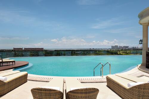 Outdoor pool, open 10:00 AM to 10:00 PM, pool umbrellas, pool loungers