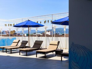 Indoor pool, outdoor pool, open 7:00 AM to 7:00 PM, pool umbrellas