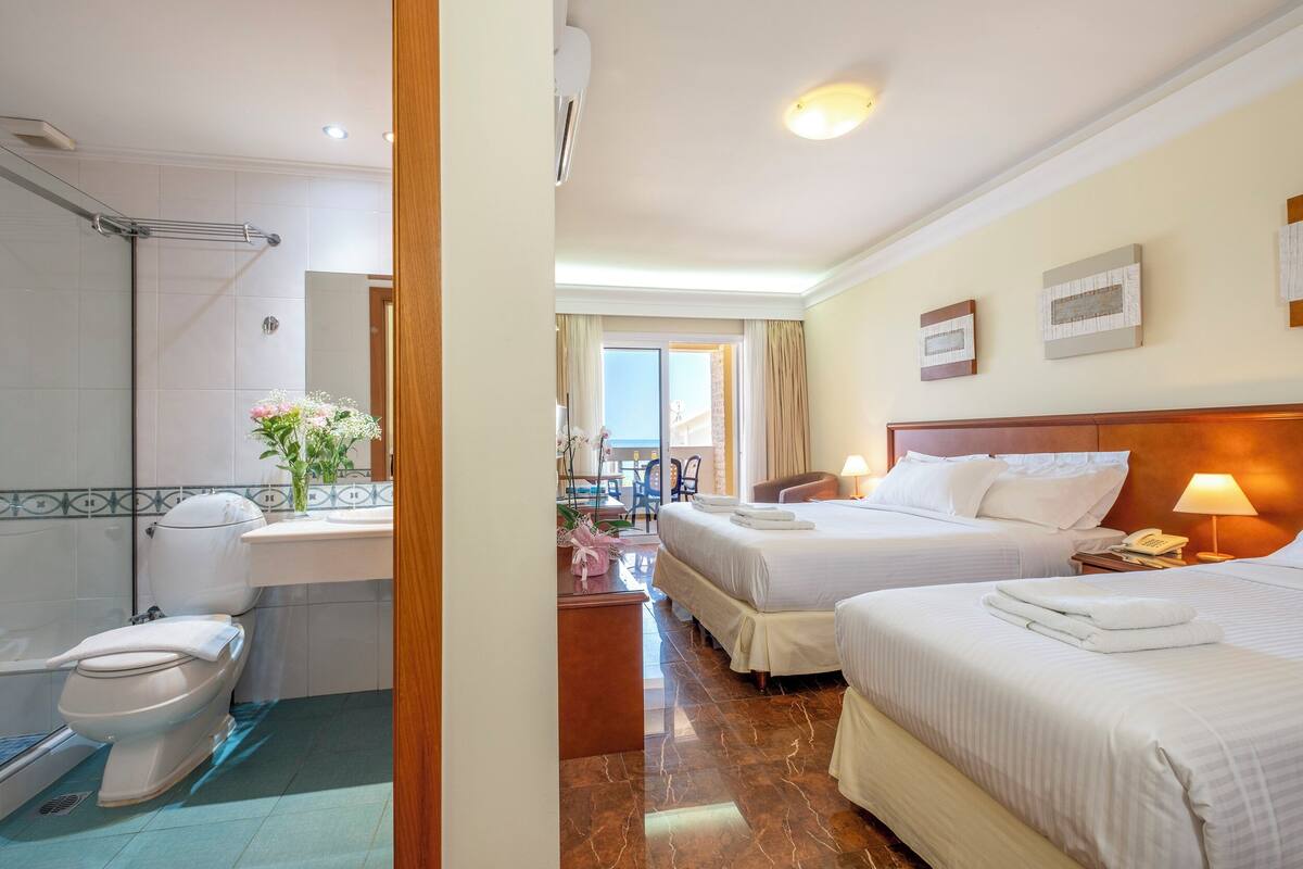 superior triple room, sea view | 1 bedroom, in-room safe, blackout curtains, soundproofing