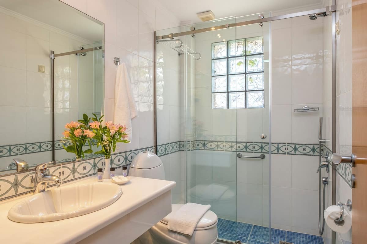 designer toiletries, hair dryer, towels