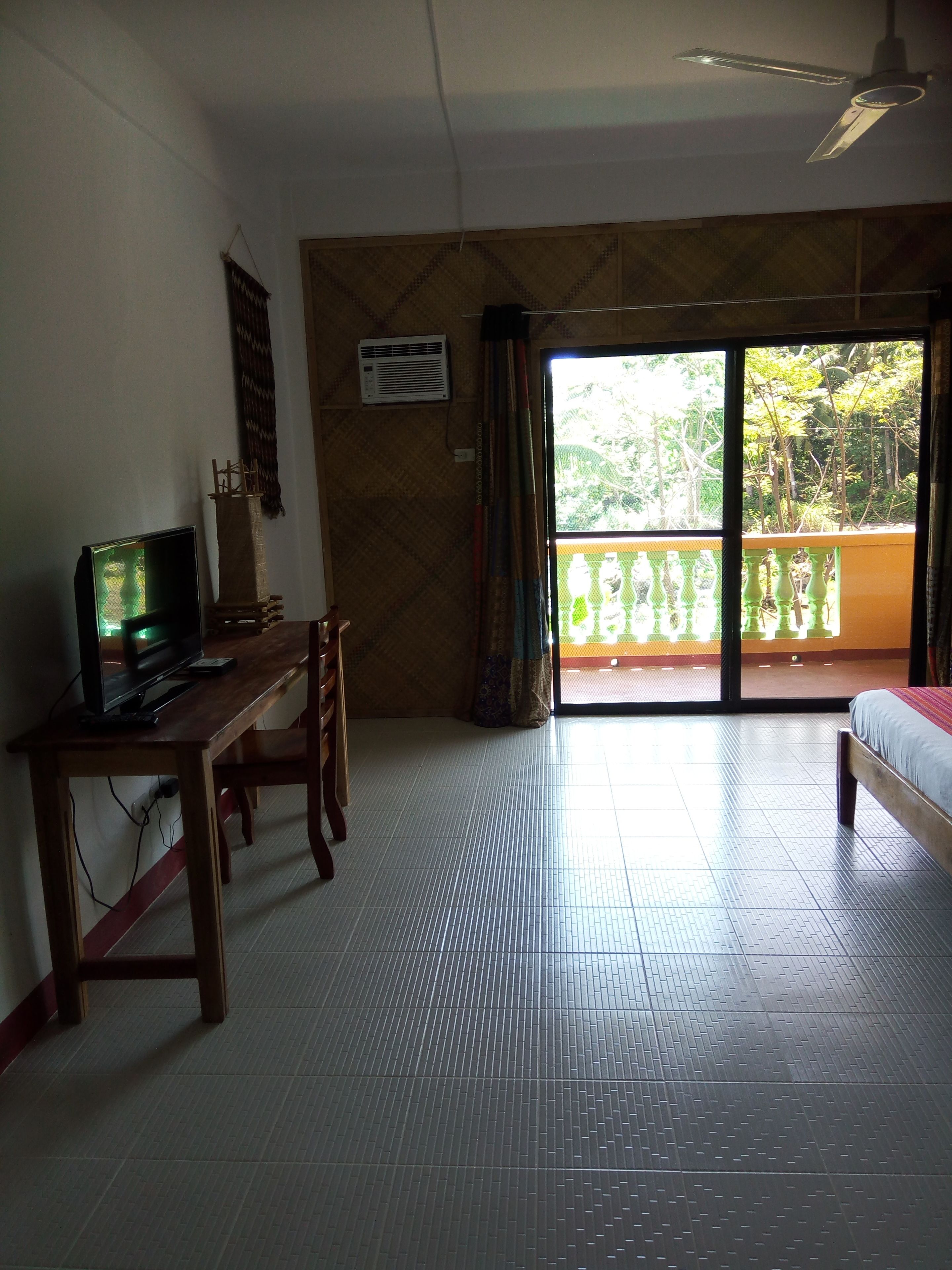 deluxe suite, 2 queen beds, balcony, partial ocean view | desk, laptop workspace, blackout curtains