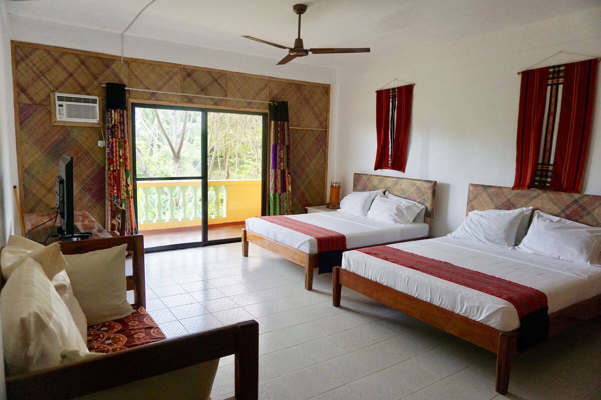 deluxe suite, 2 queen beds, balcony, partial ocean view | desk, laptop workspace, blackout curtains