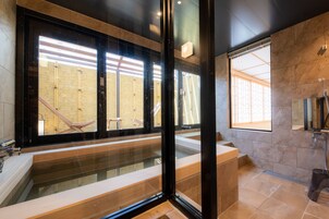 Suite Room, Non Smoking | Bathroom | Separate tub and shower, hydromassage showerhead, free toiletries