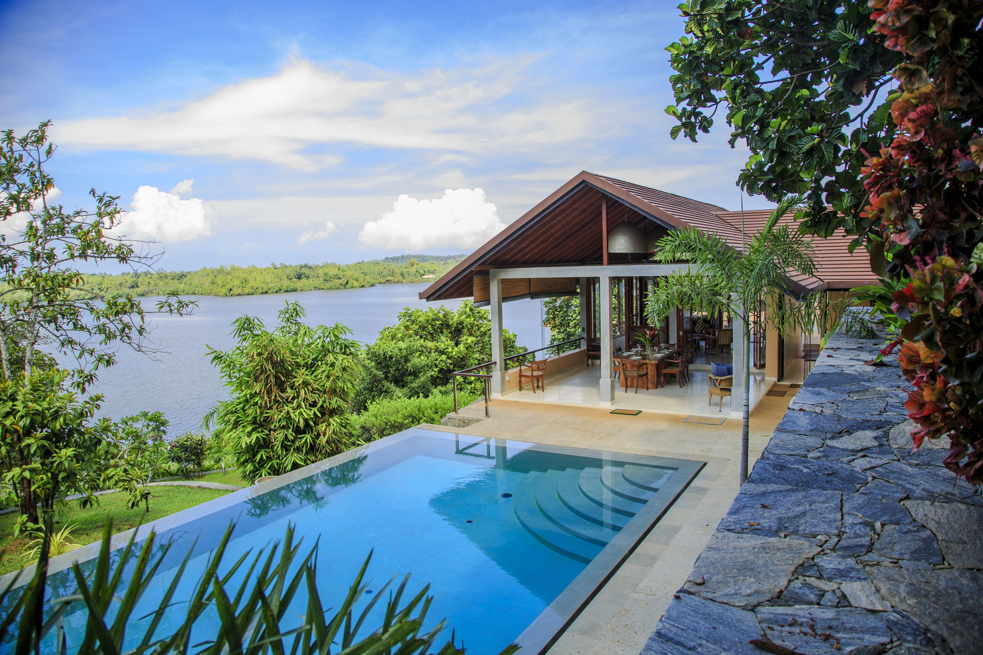 Outdoor pool, an infinity pool, pool loungers