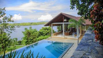 Outdoor pool, an infinity pool, pool loungers