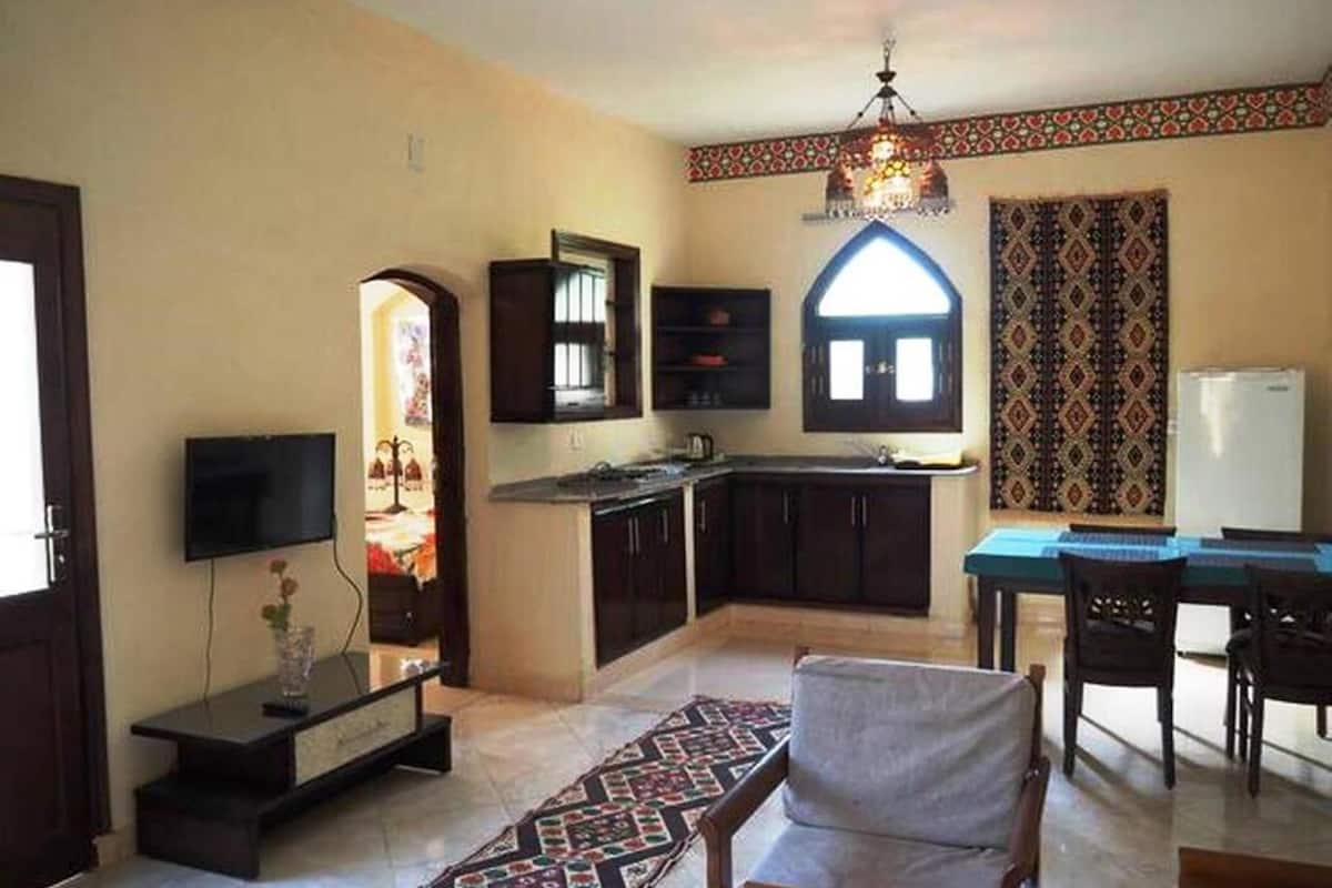 apartment, 2 bedrooms, pool view | living room | 50-cm flat-screen tv with satellite channels, tv