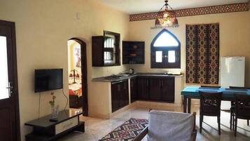 Apartment, 2 Bedrooms, Pool View | Living room | 50-cm flat-screen TV with satellite channels, TV