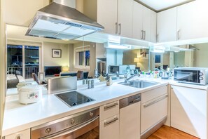 Studio Apartment (Main Floor) | Private kitchen | Full-sized fridge, microwave, oven, stovetop