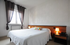 Minibar, desk, laptop workspace, blackout curtains