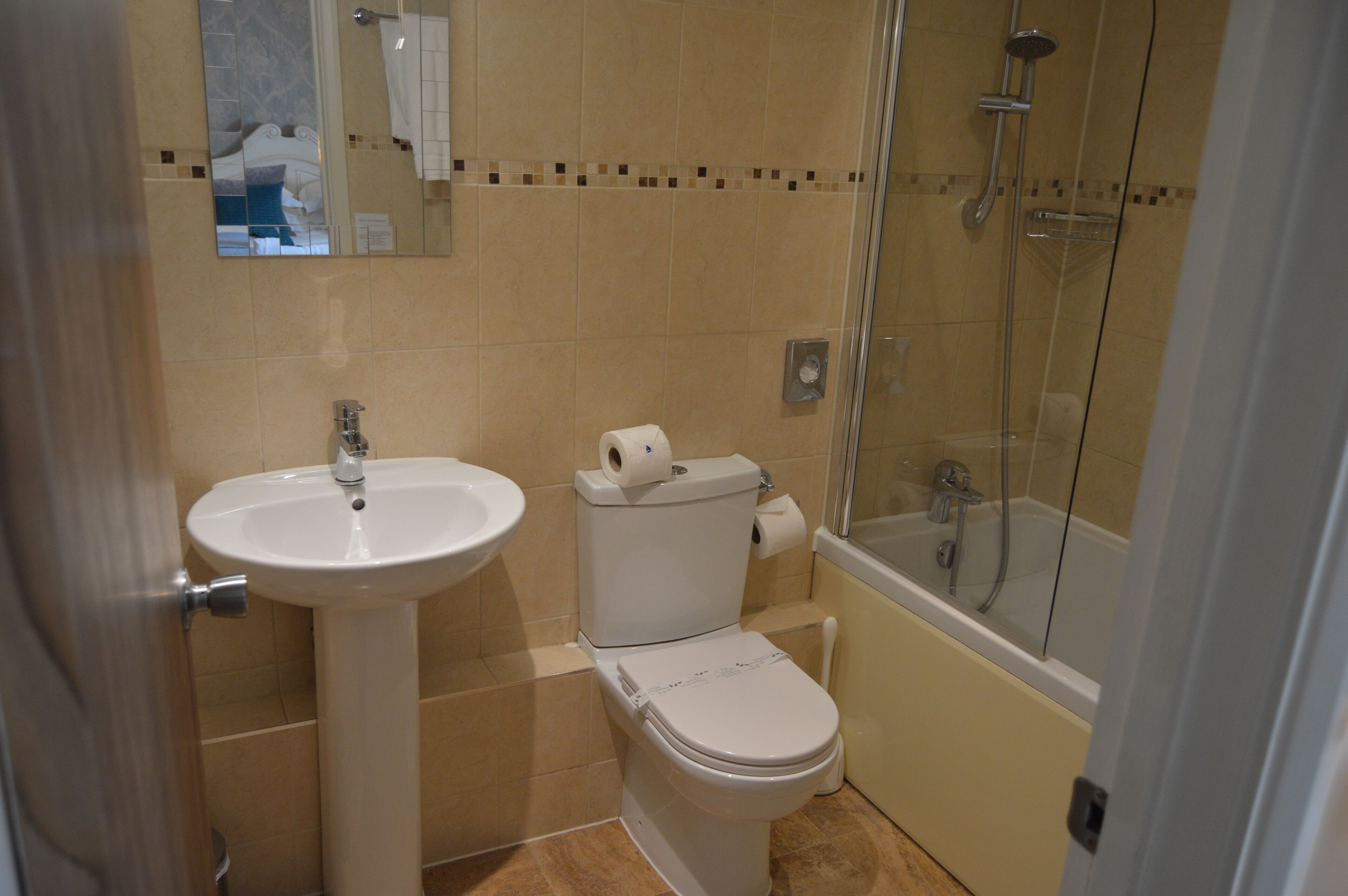 deluxe room, 1 king bed | bathroom | free toiletries, hair dryer, slippers, towels