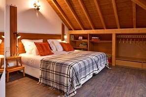 Premium bedding, desk, laptop workspace, blackout drapes