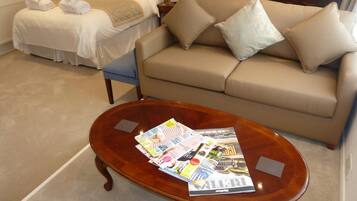 Premium bedding, desk, laptop workspace, iron/ironing board